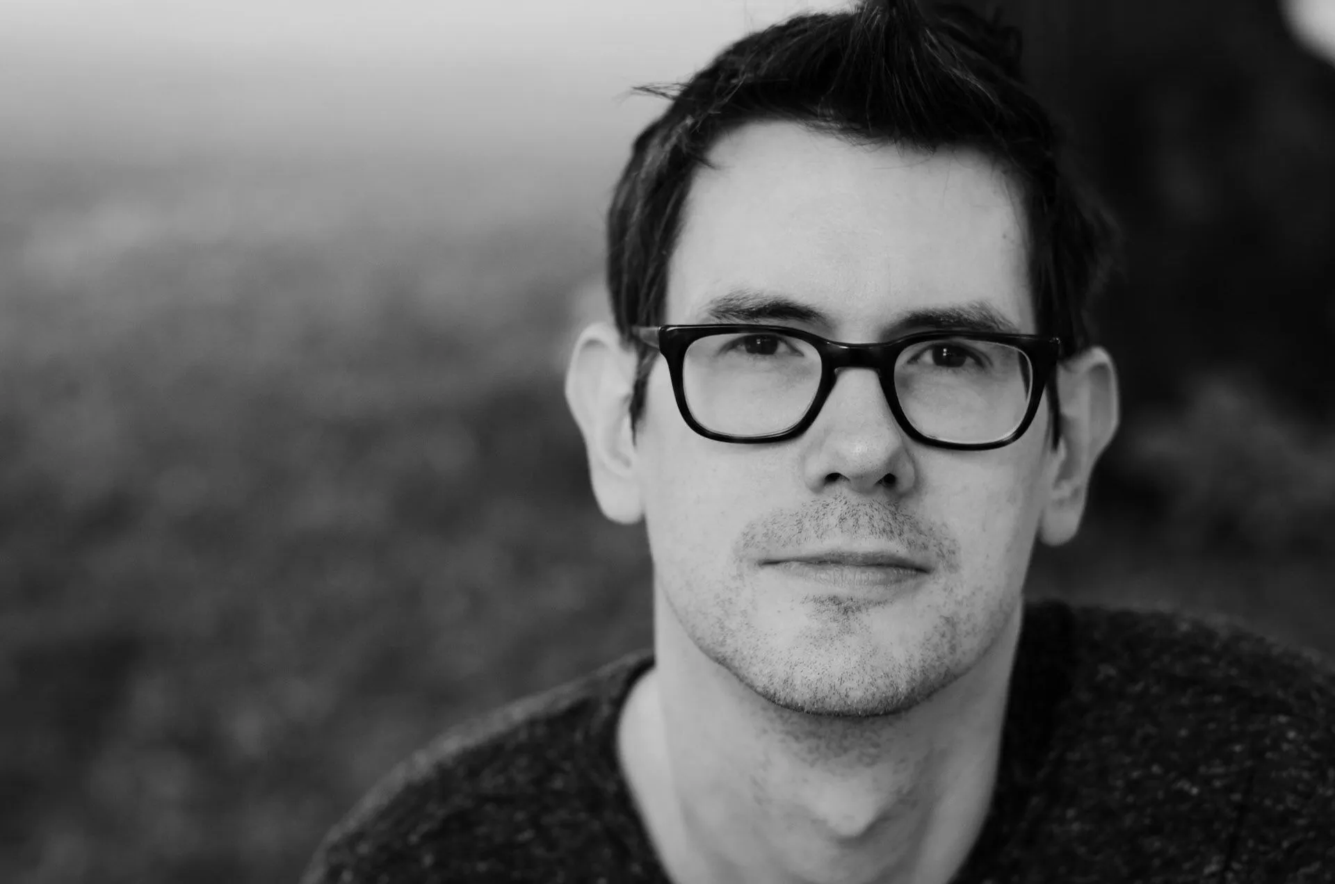 Portrait of Kent Bye with glasses.