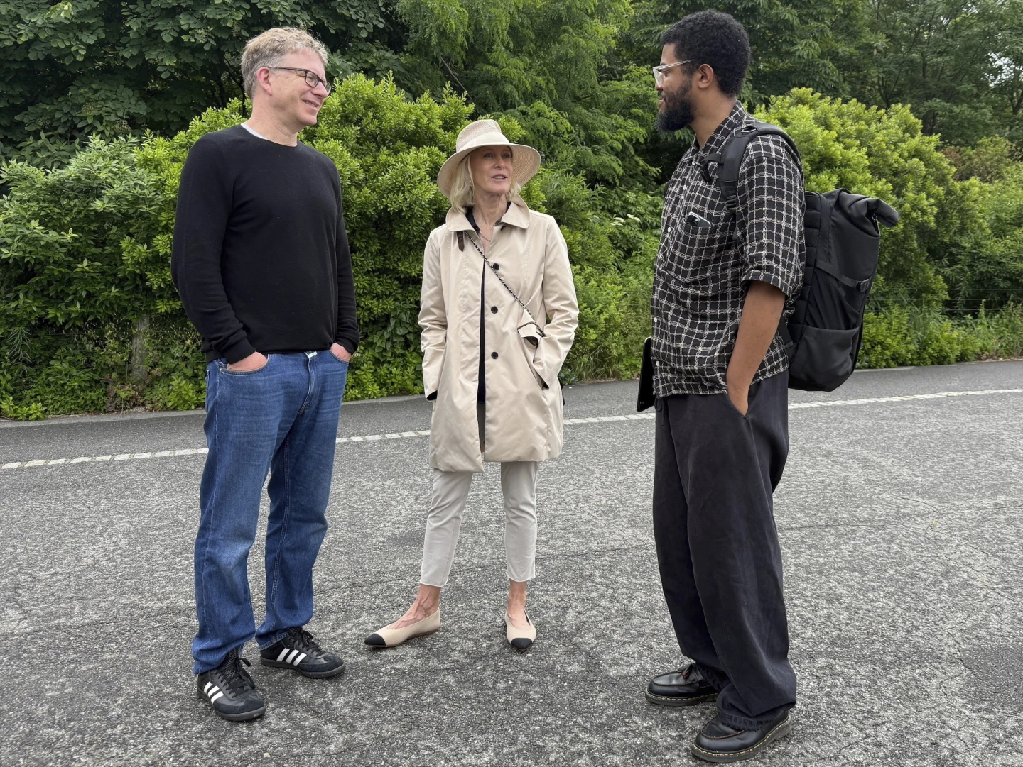 Chip Giller, Wendy Schmidt, and Idris Brewster smile together in a Brooklyn park.