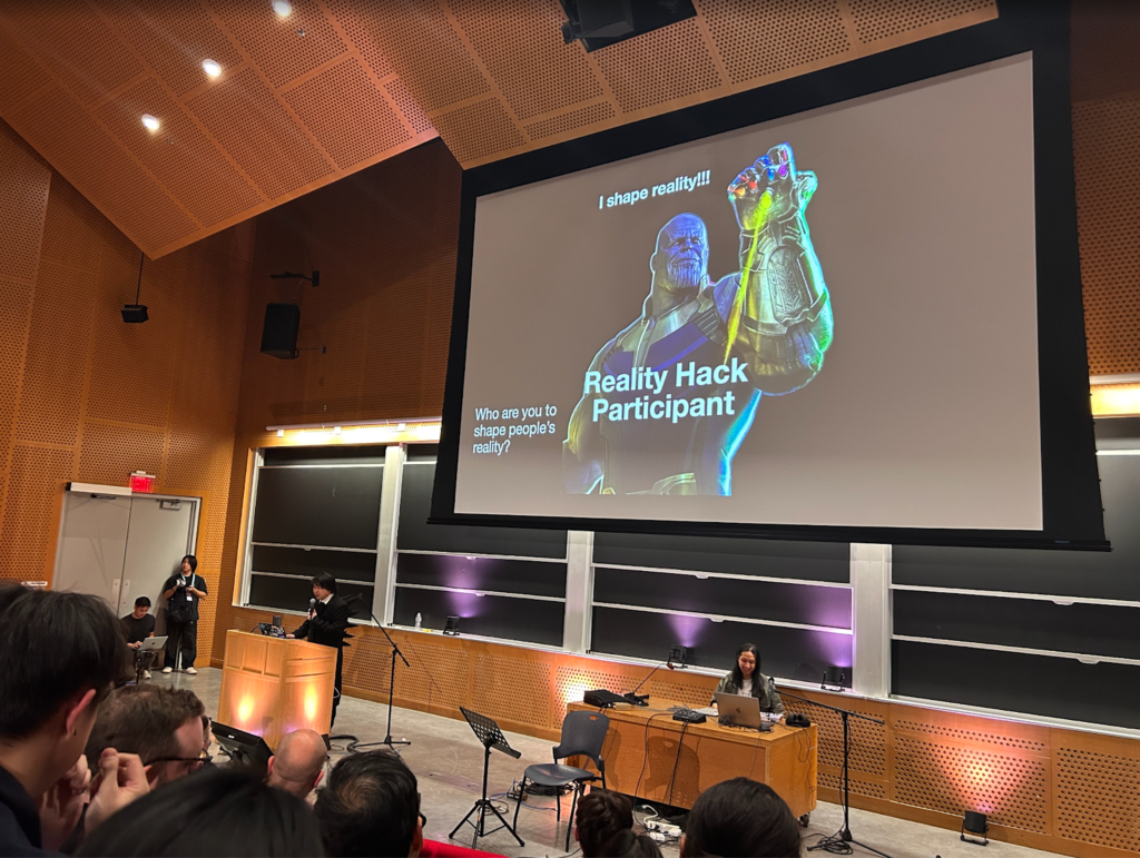 Participants view a presentation that shows Marvel character Thanos exclaiming "I shape reality!"