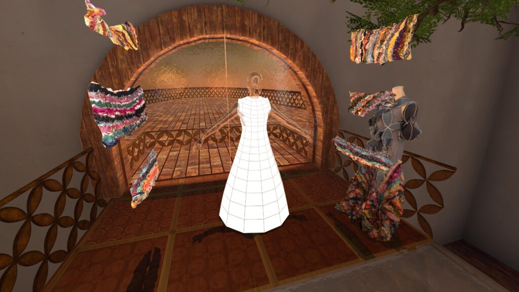 A white dress form sits at the center of a dressing room with ruffled fabric pieces hovering nearby. 